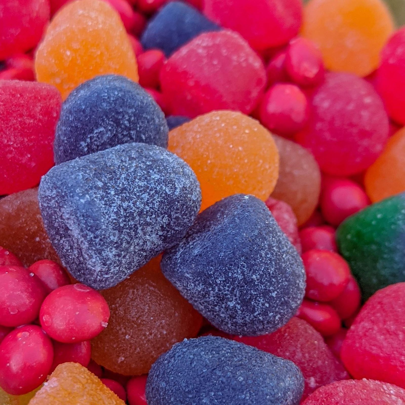 Close-up of brightly colored sugar-coated gumdrops