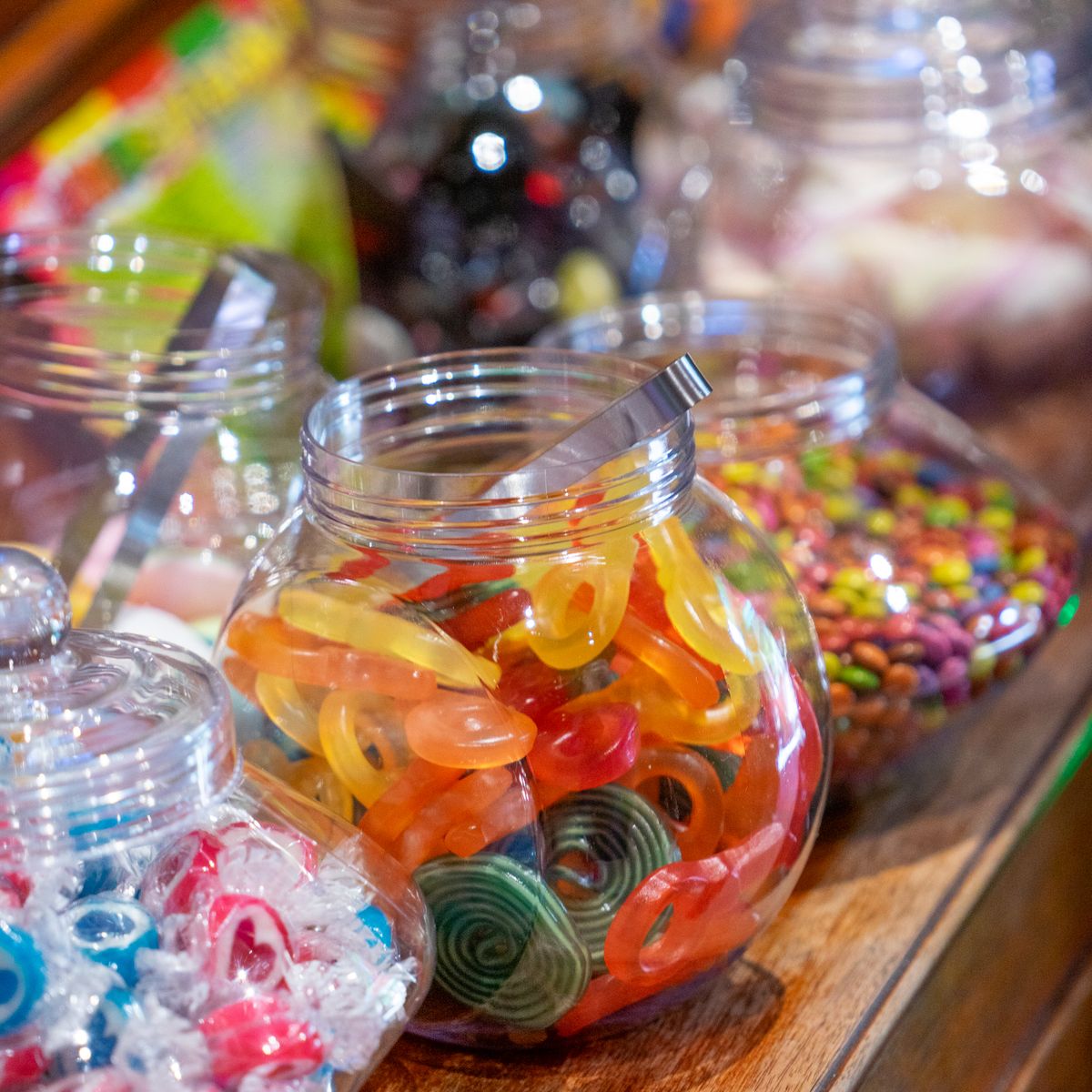 Glass jars of assorted sweets on a shop counter